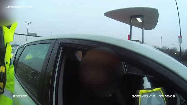 Moment police find man fast asleep at McDonald's drive-thru