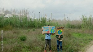 Young activists protest outside a polluting factory, advocating for eco-awareness and a cleaner future. Vertical video. Keywords: activism, pollution, global warming, hope, ecological awareness.