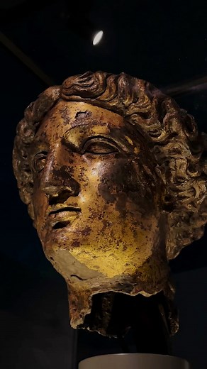 Found in the museum of The Roman Baths is one of the great treasures of Roman Britain. This is the Gilt bronze head of Sulis Minerva, the goddess of the sacred spring here in Bath. It was unearthed on the 12th of July 1727 during the construction of a new sewer below Stall Street. Originally part of a larger cult statue, it has six layers of gilding using the techniques of both fire gilding and gold leaf application. Only two other examples of gold gilt statues have been found in Britain. Could