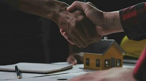 Construction and structure concept of engineer working drawing on blueprint meeting for project working with partner on model building and engineering tools in working site, construction concept.