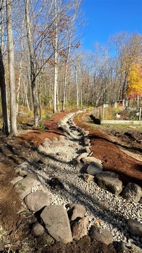 Creative Exteriors, LLC on Instagram: "Building a dry river bed in Tolland’ county. Great way to direct water away from the house. We build many of these types of dry river beds for both drainage and aesthetic. There is no better way to funnel water away from the problem areas. During the early spring rain season these man made river beds can help stop erosion and keep heavy rains from entering basements,help keep lawn areas from becoming large puddles and most importantly keep the water moving 