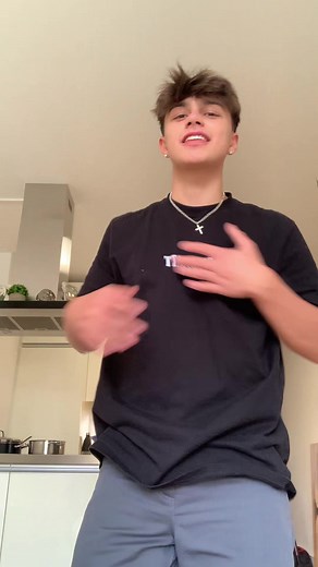 Young Male in Thrasher T-Shirt Performing Gestures