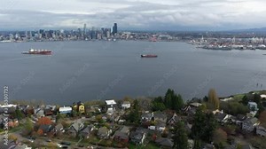 Aerial / drone footage of West Seattle, view of downtown Seattle, Container Cranes, Harbor Island, Industrial Districts, Seattle Harbor, ferry terminal, Elliott Bay in Seattle, King County, Washington