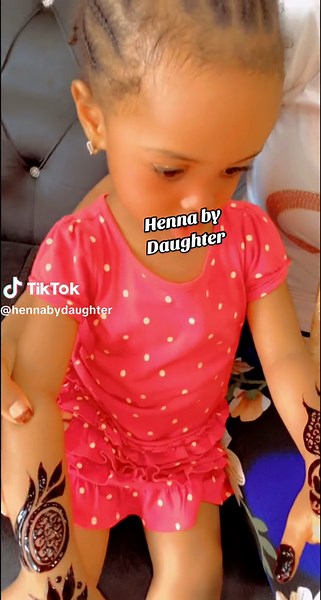 Intricate Henna Designs on a Young Girl in Pink Dress