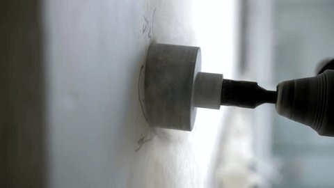 clip-4011641947-close-up-circular-drilling-drywall-installing-flush-mounted-outlet