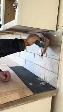 Apply grout after installing backsplash tiles