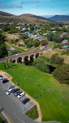 Richmond Bridge, Tasmania ✨ Australia’s oldest stone bridge, set among rolling hills and calm river bends — history and landscape in perfect balance. 💛 🎥 @rg_droneshots #experiencetasmania #richmondbridge #tasmania #tasmaniahistory #travelreels | Experience Tasmania
