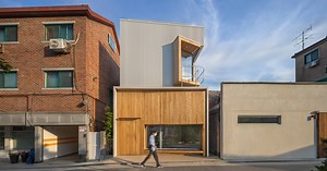 younghan chung's tiny forest house in korea unfolds as a freeform wood and steel volume