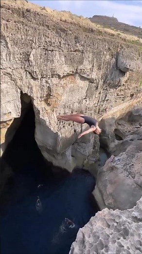 Brave woman takes the leap! Epic Cliff jumping in Malta