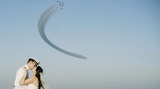 Blue Angels fly over couple's beach wedding