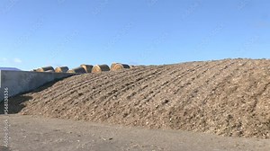 Trenches for silage harvesting. Preparation of feed for livestock feeding. Agriculture, crop production and animal husbandry. Storage silos in a trench silo