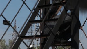 Firefighters in gas masks do their work during fire