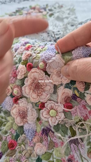 Embroidering on canvas my garden spring flowers. Stitching a Rococo big rose with cast-on technique.