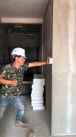 Construction Work: Installing Wall Panels in Progress