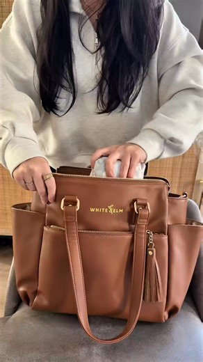 Pack the Gemini Mini Convertible Backpack with us! 🥰 • Converts from backpack to shoulder bag to crossbody • 10 thoughtfully designed pockets • Fits water bottles and tumblers up to 3.75” diameter (including a 30oz handled tumbler) • Compact but roomy interior for daily essentials • Built-in key leash for quick grab access • Structured shape for polished everyday wear • Luggage sleeve for travel days • Water-resistant lining for easy cleanup Proof that a mini bag can still do the most. Tag us w