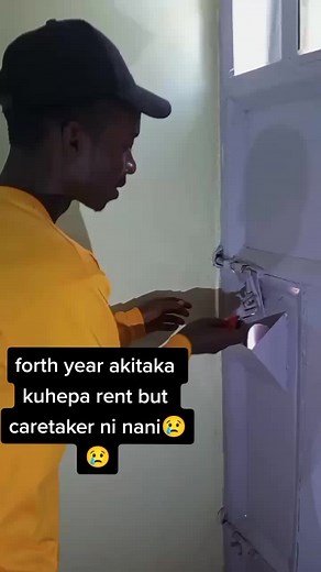 Unlocking a Metal Gate with a Red Padlock