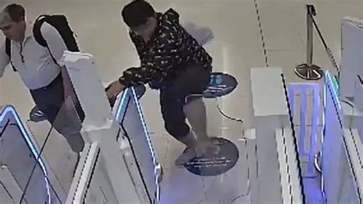 Moment passenger takes revenge on passport e-gates by KICKING his way through