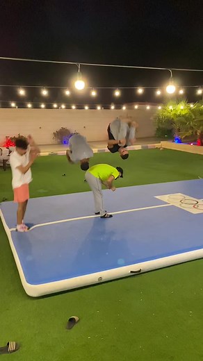 Playful Acrobatic Stunts on Olympic Rings Mat