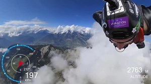 Skydiver Jumps From Helicopter and Flies Over the Swiss Mountain Range