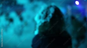 The girl in the foam turns to camera and leaves at the foam party