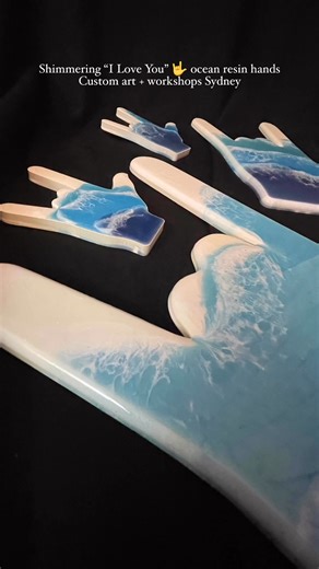 Shimmering ocean blues topped with soft white waves 🌊 Each hand shape represents “I Love You” in sign language 🤟 — a beautiful symbol of love and connection. The small ones have already sold but custom orders are available! I’m also teaching resin workshops in my Sydney studio where you can create your own meaningful ocean art. www.linktr.ee/lenoreashmore #resinart #signlanguageart #sydneyartist | Graphiq Design