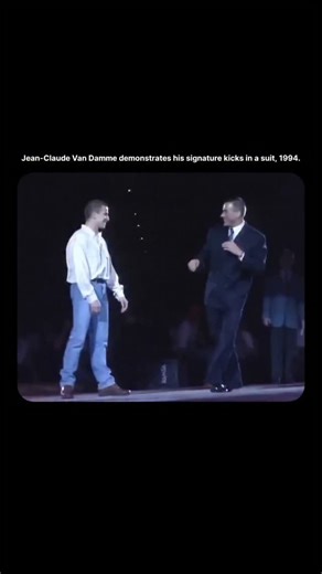 GLOBAL COMMUNITY on Instagram: "The post is a short throwback stage clip showing Jean-Claude Van Damme demonstrating his signature martial arts kicks while wearing a suit, showcasing his flexibility and precision in a live setting (1994). The video highlights his iconic fighting style and athletic control, proving why his classic action-era skills still impress fans decades later. Posted by cinesthetic., the clip reached 723K views and 4.4K likes, reflecting strong nostalgia and interest in lege