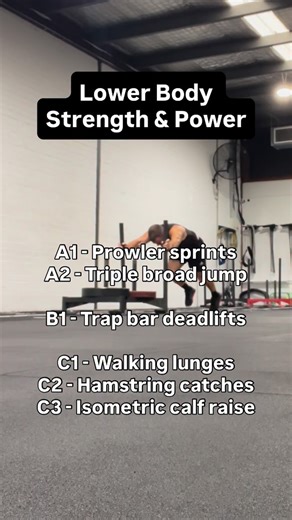 Ben Griffin on Instagram: "Monday morning, lower body strength & power: A1 - Prowler sprints - 3 x (2 x 5m) A2 - Triple broad jump - 3 x 2 B1 - Trap bar deadlifts - 4 x 3 C1 - Walking lunges - 2 x 8 each leg C2 - Hamstring catches - 2 x 5 each leg (5 second hold) C3 - Barbell isometric calf raise - 2 x 30 seconds Week 2, of a 5 week block."