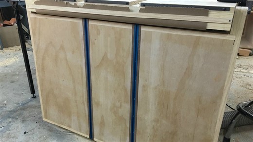 DIY outfeed table with slots and paper roll