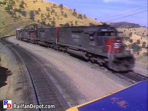 From aboard the lead engine of a Santa Fe freight descending Tehachapi Pass, we meet an upgrade Southern Pacific freight at Bealville Siding. From the Pentrex show "Cajon Pass & Tehachapi Loop" https://rfd.video/SoCal | Railfan Depot