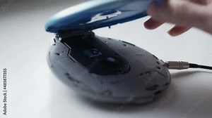 Using a Vintage Portable CD Player To Listen to Music from a Compact Disc