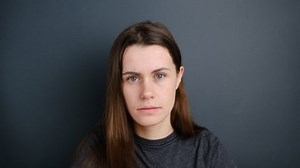 clip-1045015879-frustrated-woman-wearing-t-shirt-holding-hand-on