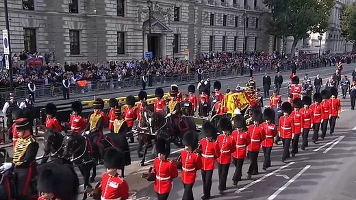 Applause as Queen's coffin procession arrives at Parliament