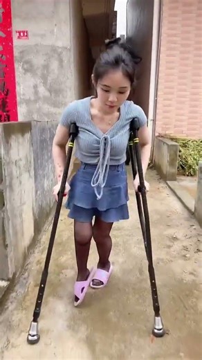 Lolicc in black stockings using crutches to help walk despite her weak legs