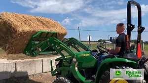 What can YOUR compact tractor do for you? This John Deere 3038E with 300E loader and 42” forks can move an 1100 pound bale. Share your compact tractor project in the comments below #GetItDone | Riesterer & Schnell | Facebook