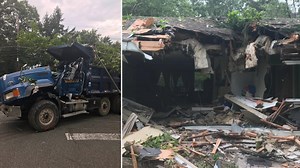 Dump truck crashes into New Jersey house, trapping driver