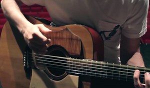 The Guitar Drum, a New Percussive Acoustic Guitar Device —Video