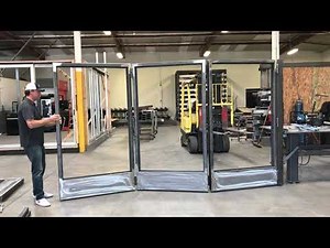 Steel bi-folding doors without track system