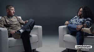 Michael is a former neo-nazi whose life was defined by rejection and hate. Tiffany is an African-American probation officer assigned to his case. Today they sit down for an I Am Second conversation, side by side, to talk about the day that Tiffany came to Michael’s house, knowing who he was on paper – his record, and the symbols of hate on his walls and his skin – but open to the possibility of a life transformed, ready to work for radical change. | I Am Second