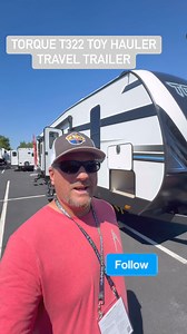 The Heartland RVs Torque T322 Travel Trailer Toy Hauler as seen at the Hershey RV Show - America's Largest RV Show #thecampoholics #HeartlandRv #torquet322 #americaslargestrvshow #HersheyRVShow #CamperShow #campershopping #toyhauler #traveltrailertoyhauler #campershopping #hearheyrvshow2024 | The Campoholics