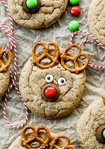REINDEER COOKIES make the easiest Christmas treat! All you need are peanut butter cookies, a few pretzels and some candies. Aren't they cute! Kids love making these. Recipe: https://tastesbetterfromscratch.com/reindeer-cookies/ | Tastes Better From Scratch