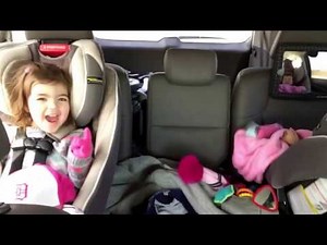 The girls laughing in the car