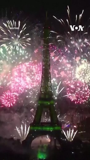 Fireworks sparkled around the Eiffel Tower to close the Bastille Day celebrations in France on July 14, 2022. During one segment the Parisian monument lit up in the colors of the Ukrainian flag while the country's Eurovision-winning song, "Stefania" by Kalush Orchestra, provided the soundtrack for the lights show. Bastille Day commemorates the storming of the Bastille prison in 1789, one of the key events of the French Revolution. The day has become a national holiday in France. (Reuters) | Voic