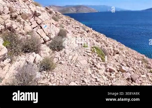 Rugged coastal path offers stunning ocean views and serene natural beauty. Hiking trail near Baska, Krk island, Croatia Stock Video Footage - Alamy