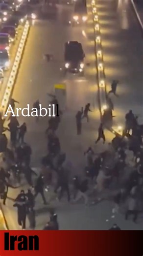 YNews on Instagram: "APC Drives Into Protesters in Ardabil, Killing at Least One Woman An armored personnel carrier belonging to Iran’s riot control forces deliberately drove into a crowd of protesters in Ardabil, according to a new investigation by the Iran Human Rights Documentation Center. The IHRDC said it conducted a frame-by-frame geolocation analysis of video footage and independently verified the scene as Yahyavi Square, citing matching visual markers such as the river alignment, nearby 