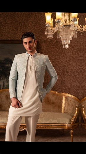 a cream-colored kurta and straight-cut trousers, paired with a light pastel blue embroidered jacket (sherwani-style or Nehru jacket). The jacket features intricate floral embroidery along the front panels and collar, giving it a refined and festive look #foryoupage❤️❤️ #pastecolours #mensfashion #kurtapajama #surreybc