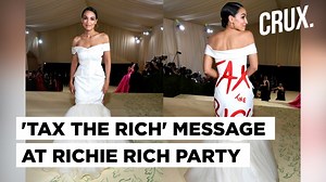 A US politician grabbed all eyeballs when she walked down the red carpet at the Met Gala event in New York. Congresswoman Alexandria Ocasio-Cortez made a political statement at her first Met Gala appearance. Ocasio-Cortez wore a white gown with the message ‘tax the rich’ written in red. AOC defended her attire in an Instagram post saying – ‘the medium is the message’. | News18