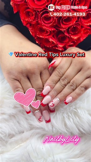 Big Red Nails Salon Lincoln Ne on Instagram: "💎 VALENTINE RED TIPS LUXURY SET 💎 Love at first nail 💖✨ Fall in love with your hands this Valentine 💋 Glossy nude base + ruby red tips + crystal accents = PURE LUXURY 💎❤️ Perfect for: 💍 Date night 💃 Girls night 💝 Valentine surprise 📸 Instagram moments 📍 Big Red Nails & Spa – Lincoln’s Top Nail Salon 2026 ✨ Trusted by 20,000+ happy clients 🏆 Voted Best Nail Salon 📲 Book now before spots fill up! 👉 bigrednailsspalincoln.com 📞 402-261-4193