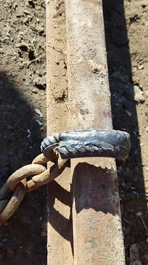 Exploring Rusty Metal Chains and Pipes in Construction