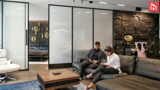 A modern bachelor pad with smart glass space dividers