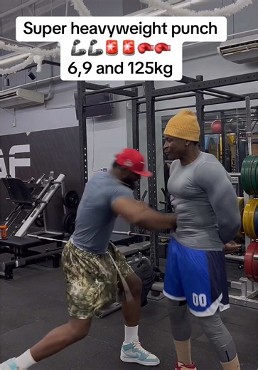 Professional Boxers Training with Heavy Punching Bags